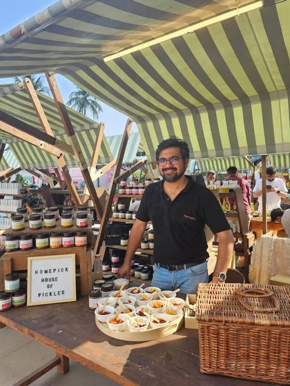 Here I am at our stall at The Green Co-op, ready to share our house of pickles with everyone. These events are a great way to connect with our community.