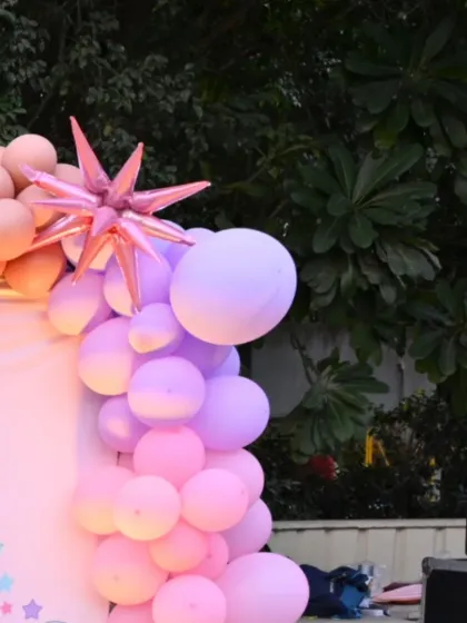 A close-up of the pastel balloon garland with a starburst balloon accent.