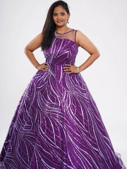 This purple ball gown with a "shooting stars" sequin pattern is a unique and eye-catching piece. It's perfect for someone who wants to stand out at their event.