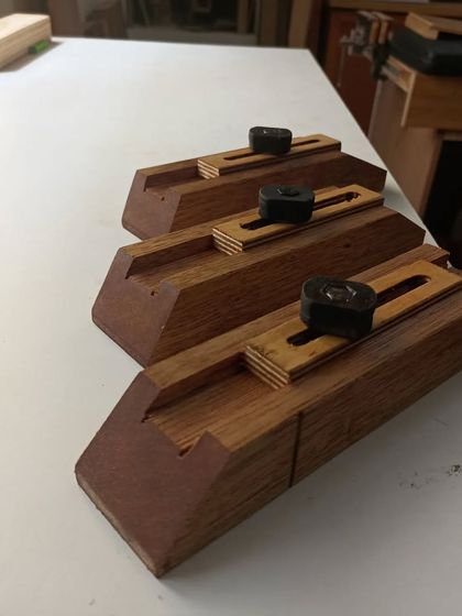 Another view of the custom-made jigs for cutting angles. These are essential for making the small, intricate pieces that form the beautiful patterns inside the main grid.
