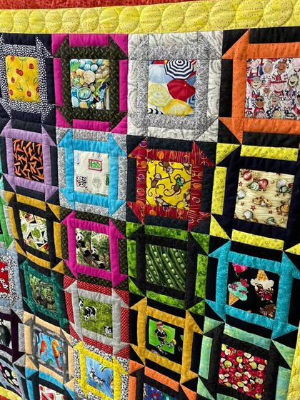 A detailed shot of the fussy cut quilt, showing the intricate pictures inside each block.
