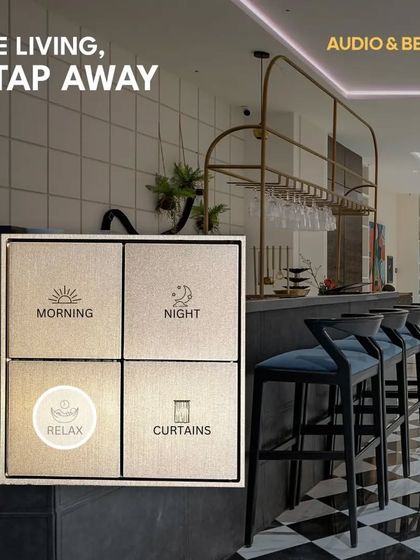 Fine living is just a tap away. This image highlights a custom-labeled smart keypad in a modern bar area, offering preset scenes for 'Morning', 'Night', and 'Relax' to instantly adjust the ambiance.