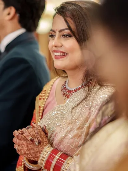 Another candid moment from the reception. The bride's smile is radiant, and her makeup looks fresh and flawless even after hours of celebration.