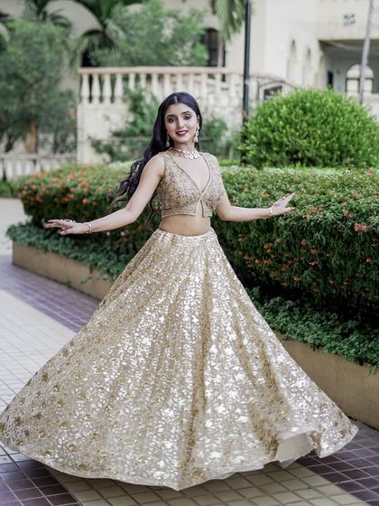 The full flare of this golden sequin lehenga is made for dancing. It’s a fun, glamorous, and show-stopping outfit available for you to rent for your special night.
