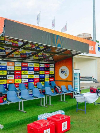 The player dugout we set up for the TNPL, complete with branded backdrops and an integrated LED screen.