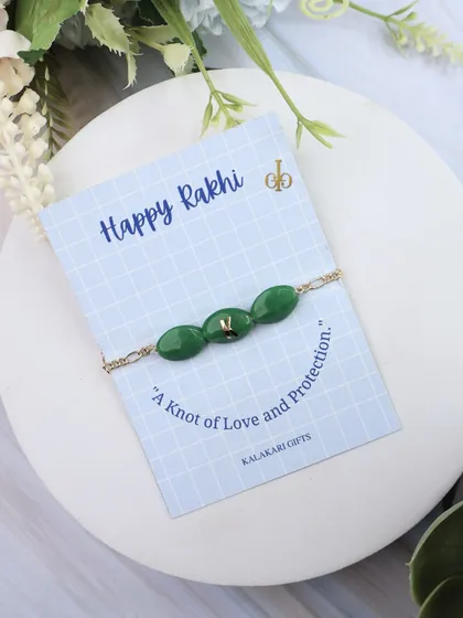 Another look at our dark green Quartz Rakhi with a custom initial.