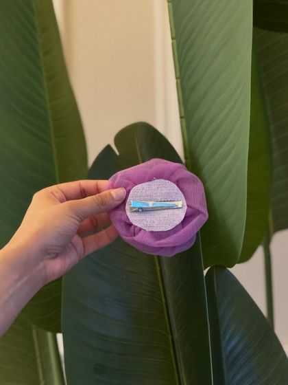 The back of our organza rose clip, showing the alligator clip that holds it firmly in your hair.