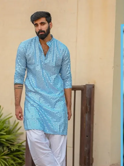 A sky blue kurta with mirror work, a fresh and vibrant option for daytime celebrations.