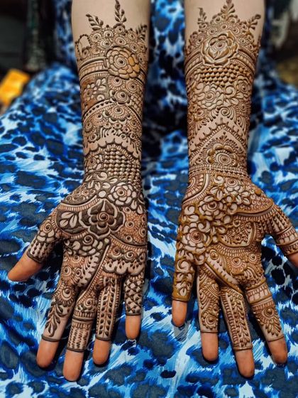 The full view of the engagement bride's mehendi, showing the beautiful symmetry and flow of the design.