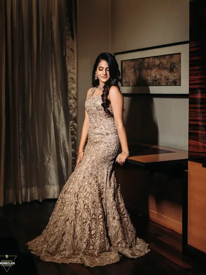 A full-length portrait of the bride in her stunning, intricately embroidered gown, showcasing her elegance and the beauty of her engagement outfit.