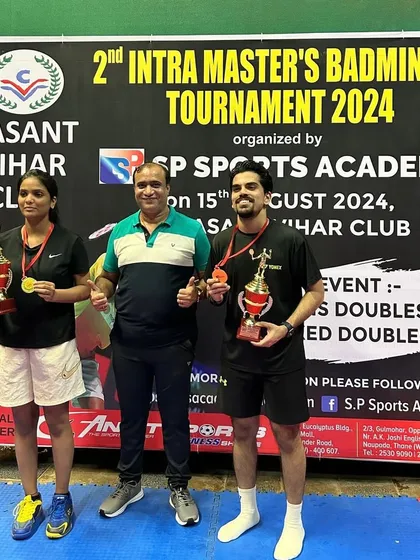 Champions of the Mixed Doubles Group C & D, Coach Ajay and his partner Shweta.