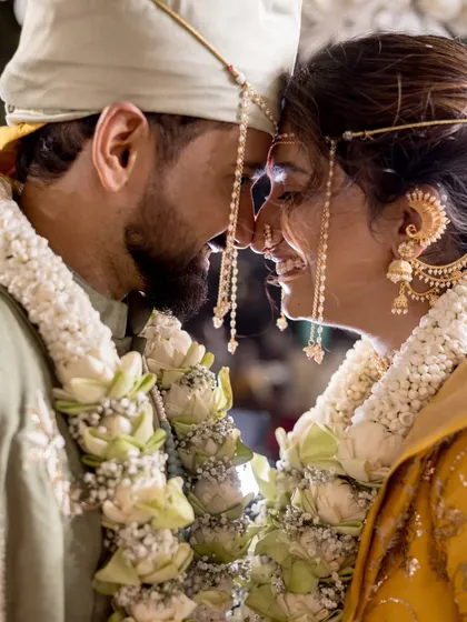 An intimate close-up of the couple, their foreheads touching.
