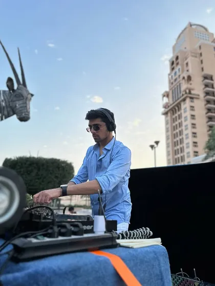 A sundowner set in Doha with a unique Oryx statue in the background. I'm always inspired by the local art and culture of the places I visit.