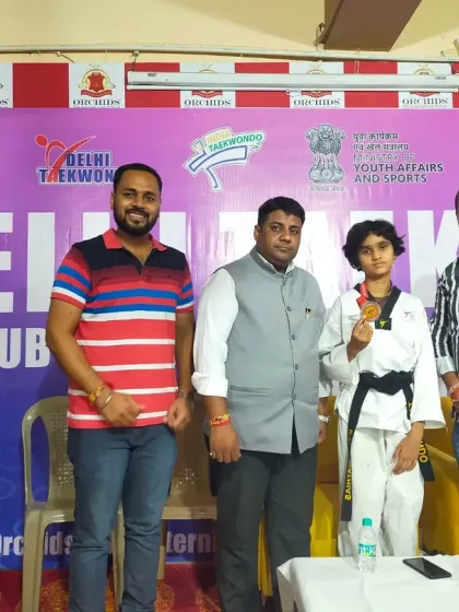 Posing with our silver medalist at the Delhi Taekwondo State Championships. We support our students on and off the mat.