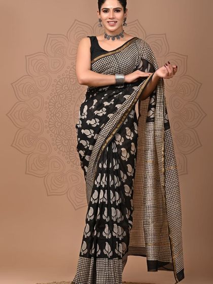 A black pure Chanderi cotton silk saree with a beautiful white floral hand block print.