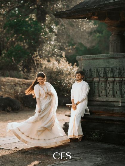 A candid shot of the bride-to-be's joyful movement, her lehenga twirling as she walks, creating a dynamic and happy image.