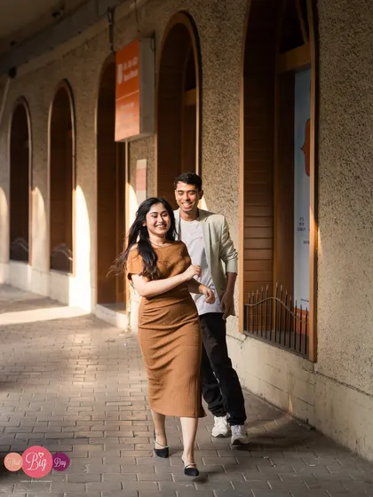 The follow-up to a playful chase, this candid photo is filled with genuine smiles and movement, capturing the couple's dynamic perfectly.