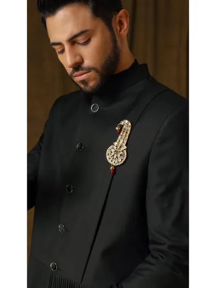 A close-up of the Vishudh bandhgala, focusing on the intricate pleats and pintucks on the lower portion that add visual interest to the timeless piece.