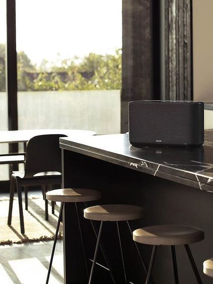 Our audio solutions extend throughout your home. A wireless multi-room speaker from Denon, placed on a kitchen counter or in a study, allows you to stream music effortlessly, creating a cohesive audio experience that follows you from room to room.