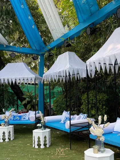 I love creating a variety of seating options. These cabana-style daybeds with custom blue and white printed cushions offered a comfortable and stylish lounging option for guests.