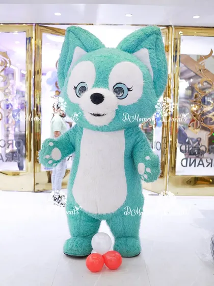 This adorable teal and white fox mascot was a huge hit, greeting guests at the entrance and adding a whimsical touch to the celebration.