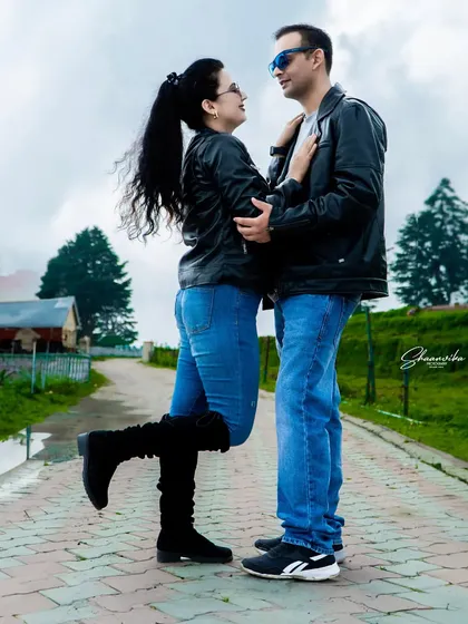 A fun and romantic pose that shows the couple's chemistry. Pre-wedding shoots are all about capturing your natural interactions.