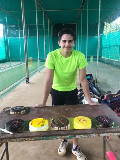 Kunal standing with his birthday cakes at the academy. We make sure every player feels special.