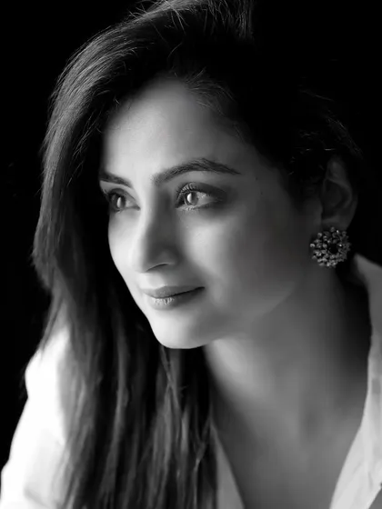 Another beautiful black and white portrait of Madirakshi Mundle, this time with a more thoughtful, distant gaze, adding another layer of emotion.
