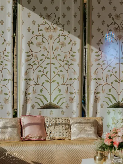 Custom-printed fabric panels with delicate floral motifs served as a beautiful backdrop for Aashvi and Akash's wedding. The soft ivory and green palette created a serene and elegant atmosphere.