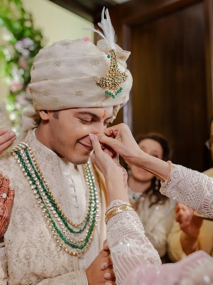 A playful and loving moment where the family teases the groom.