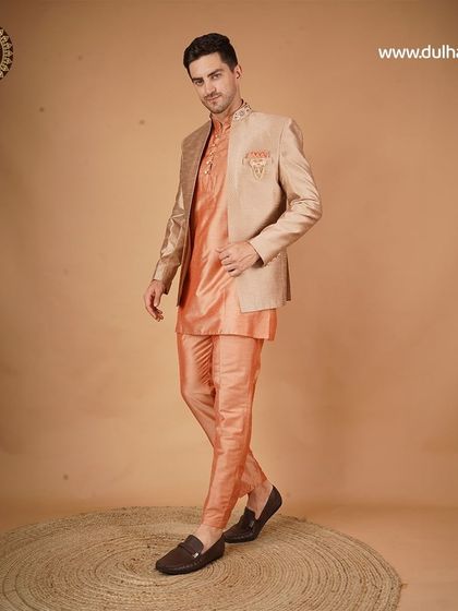 A peach kurta pajama with a beige jacket, a warm and elegant choice for an engagement or daytime event.