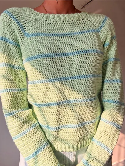Who knew a few skeins of yarn could turn into this cozy striped sweater? I used a soft acrylic yarn in pastel green and blue for this piece, making it super comfy and perfect for those moody weather days.