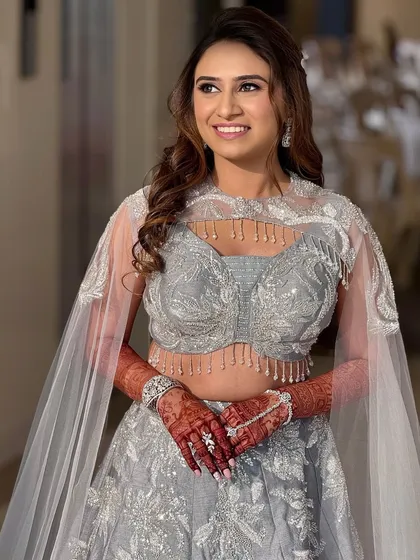 A happy and confident portrait of the bride on her sangeet night. The glittery eyes and soft curls are a perfect combination for a night of dancing.