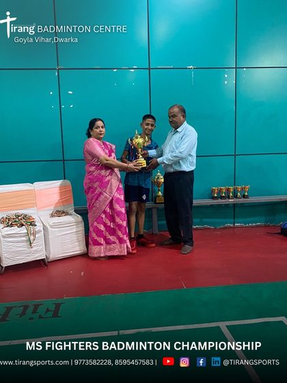 Celebrating the winner of a youth category. The joy of competition is central to the tournaments I organize.