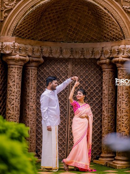 A couple dances in front of our grand, carved wooden doors, a perfect setting for a traditional and elegant photo.