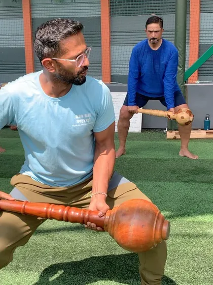 Here's a look at a golf fitness session in action. I work with golfers to build strength using traditional tools like the Mugdar, focusing on the core movements that generate power and stability in the golf swing.