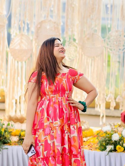 A candid laughing shot from a fun-filled Haldi event. My goal is to make sure I'm having as much fun as the guests.