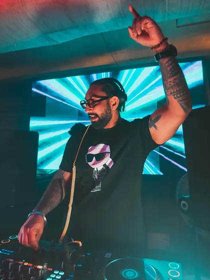 Hyping up the crowd at a club in Kolkata. My performance style is interactive and energetic, ensuring everyone feels like part of the show.