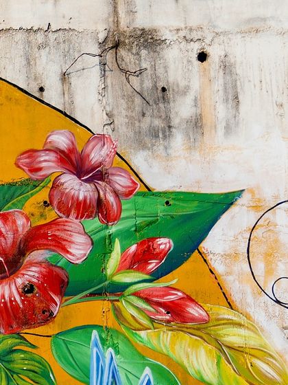Detail of the vibrant red hibiscus flowers I painted as part of the Coorg mural's rich foliage.