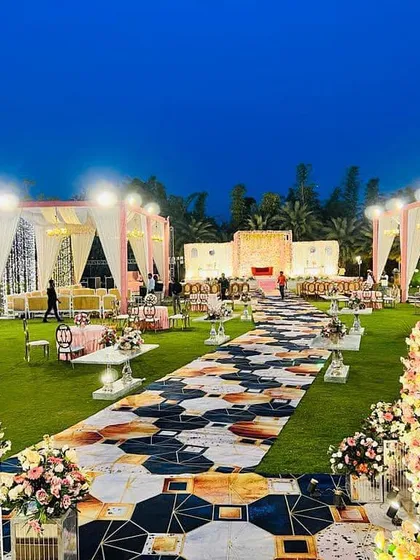 This is how we transform an open lawn into a breathtaking wedding venue. This wide view shows the complete setup, including the elegant guest seating, a beautifully designed aisle, and the main stage, all planned and executed by my team.