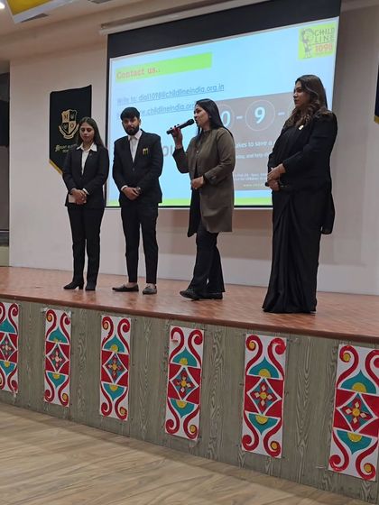 The principal of Mount Olympus School speaking to the students alongside my team and me. This shows a united front from both the school administration and legal experts in prioritizing child safety.