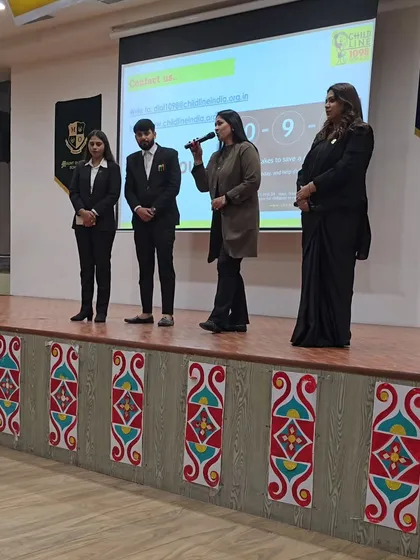 The principal of Mount Olympus School speaking to the students alongside my team and me. This shows a united front from both the school administration and legal experts in prioritizing child safety.