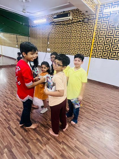 A candid moment of kids interacting and sharing their gifts. These are the moments that build a strong and friendly community in the studio.