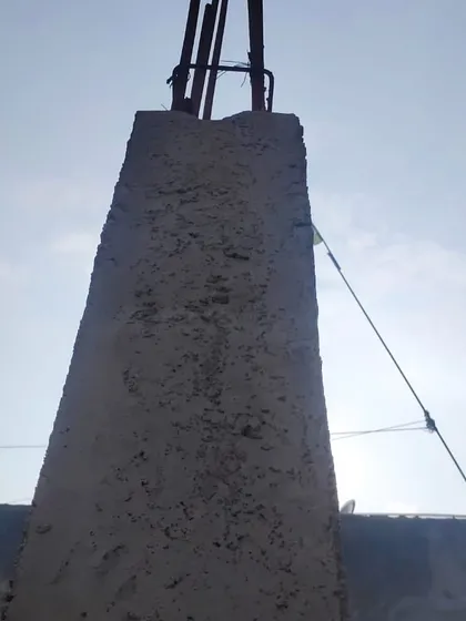 A close-up of a reinforced concrete column, showing the steel rebar extending upwards. This highlights the focus on structural integrity which is a core part of my architectural planning.