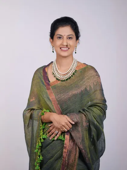 A graceful individual portrait of a woman in a beautiful saree, taken as part of a family studio session. I ensure everyone gets their moment to shine.