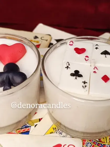 Perfect for Diwali card parties, my poker-themed candles are a guaranteed conversation starter. This set features two glass candles, one with card suit embeds and the other with a royal flush design.