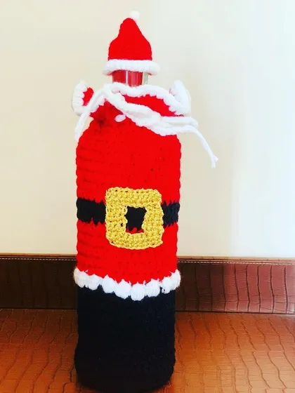 This Santa bottle cover has a cute drawstring top designed to look like his sack of presents.