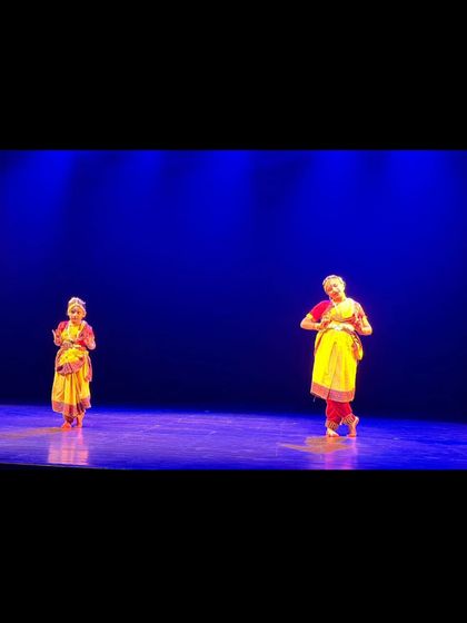 Two of our Bharatnatyam students presenting a Krishna Bhajan. Duet performances help students learn synchronization and interaction on stage, enhancing their collaborative skills.