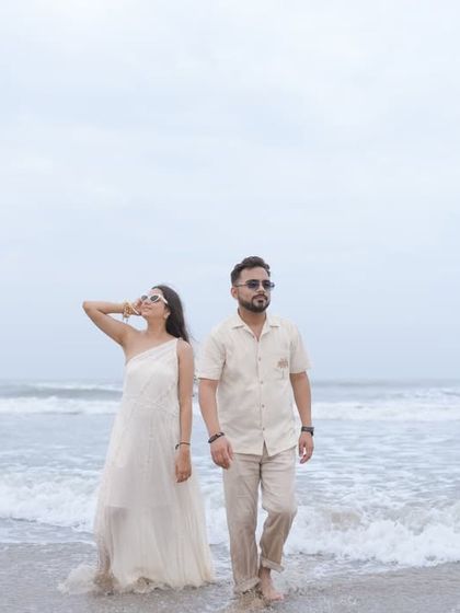 A cool and stylish shot of the couple walking out of the ocean. This photo has a relaxed and confident vibe, perfect for a Goa shoot.