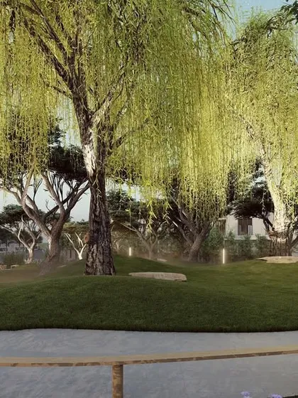 The green spaces in our townships are meticulously planned for beauty and tranquility. Here, a grove of weeping willow trees creates a serene, park-like setting within Ameeras, offering a peaceful escape and a testament to our commitment to landscape architecture.